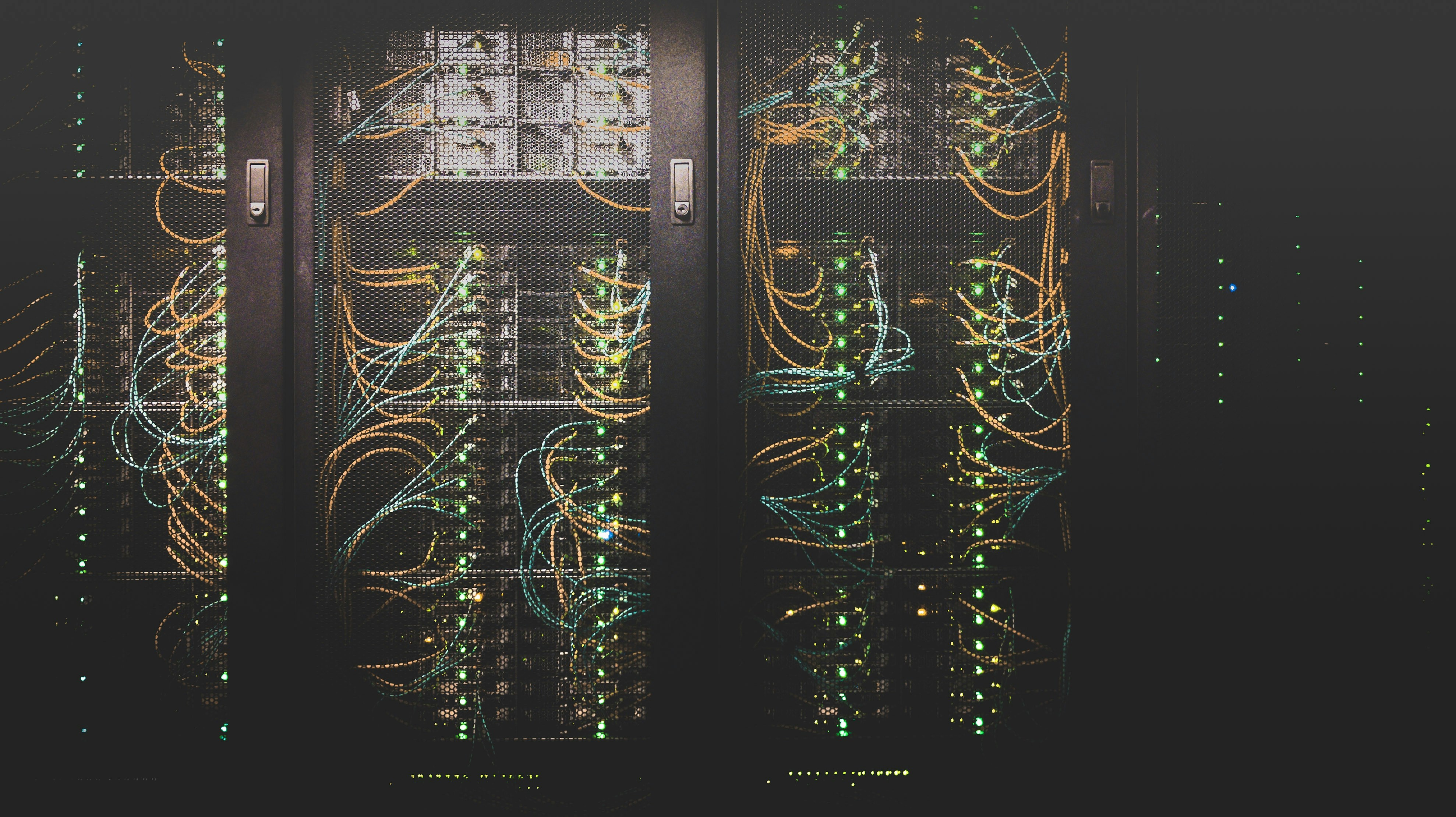 Cover image for the post. Server rack with wires. Photo taken by Taylor Vick.